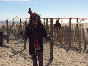 Masked Figure At Octoberfest Beach Maze