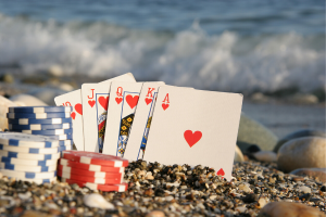 Cards And Chips In Sand 1