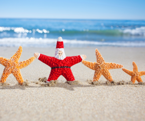 Starfish Santa on a Beach with three starfish around him.